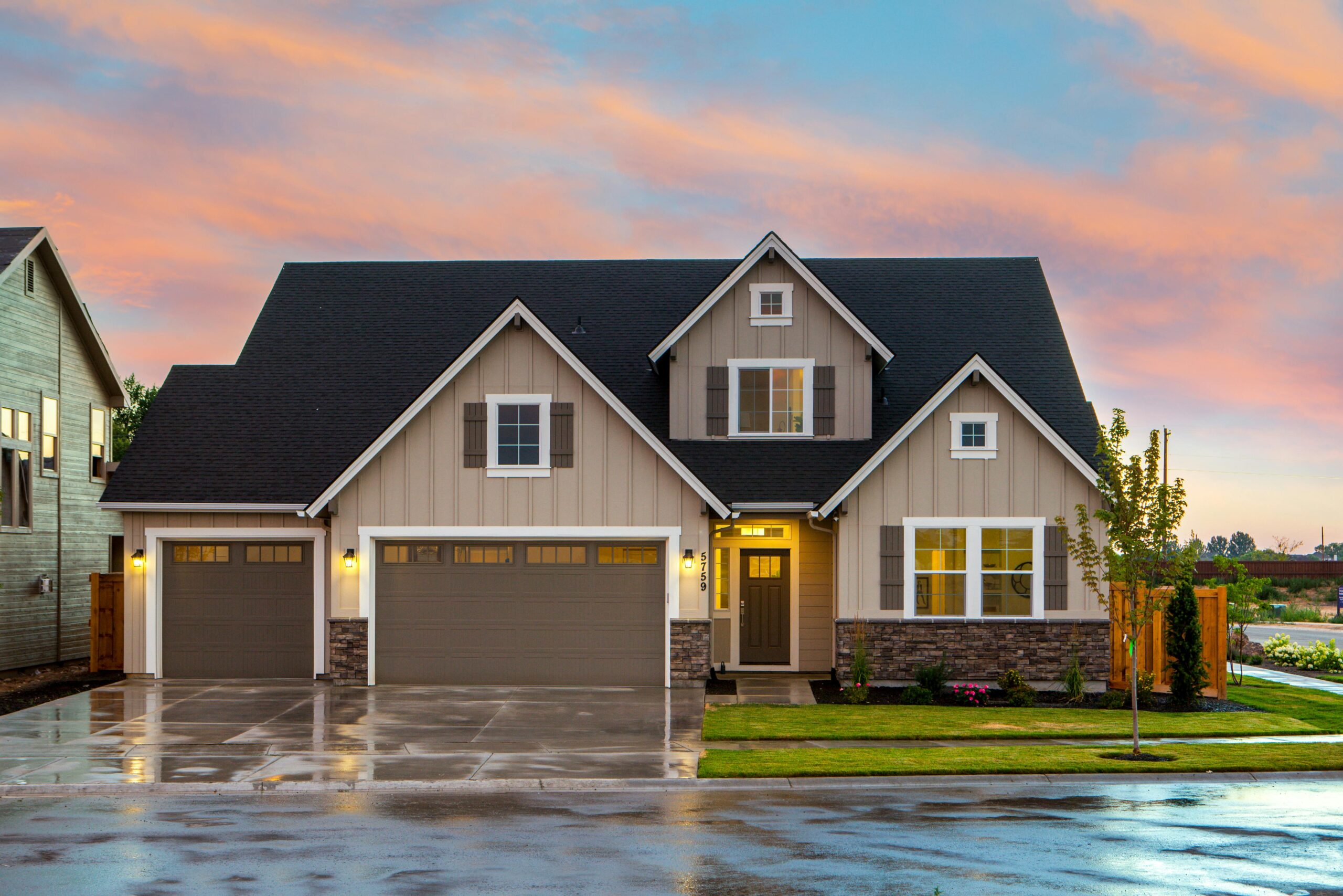 Brown home at sunset with curb appeal and warm lighting, representing Gainesville real estate in a peaceful residential setting